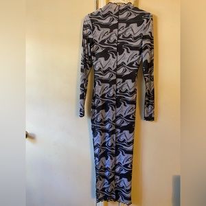Swirls mesh see through dress. Can be worn as bathing suit cover up or dress.